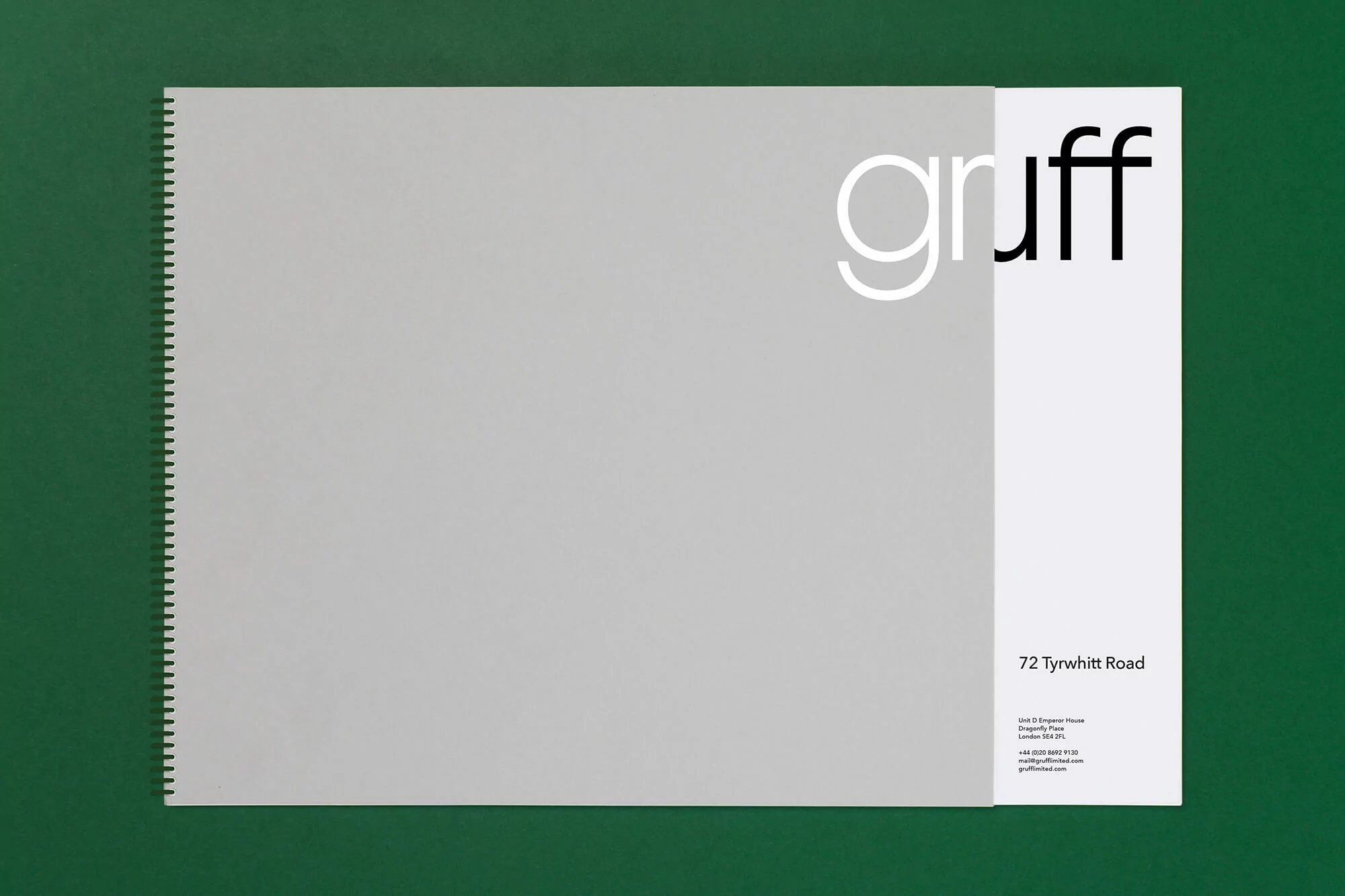 Promotional material featuring Gruff branding, set against a deep green backdrop. Minimalist design showcasing the company's logo and contact information.