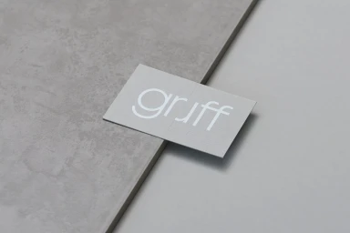 Minimalist brand identity card featuring the word gruff in lowercase white typography on a grey textured surface
