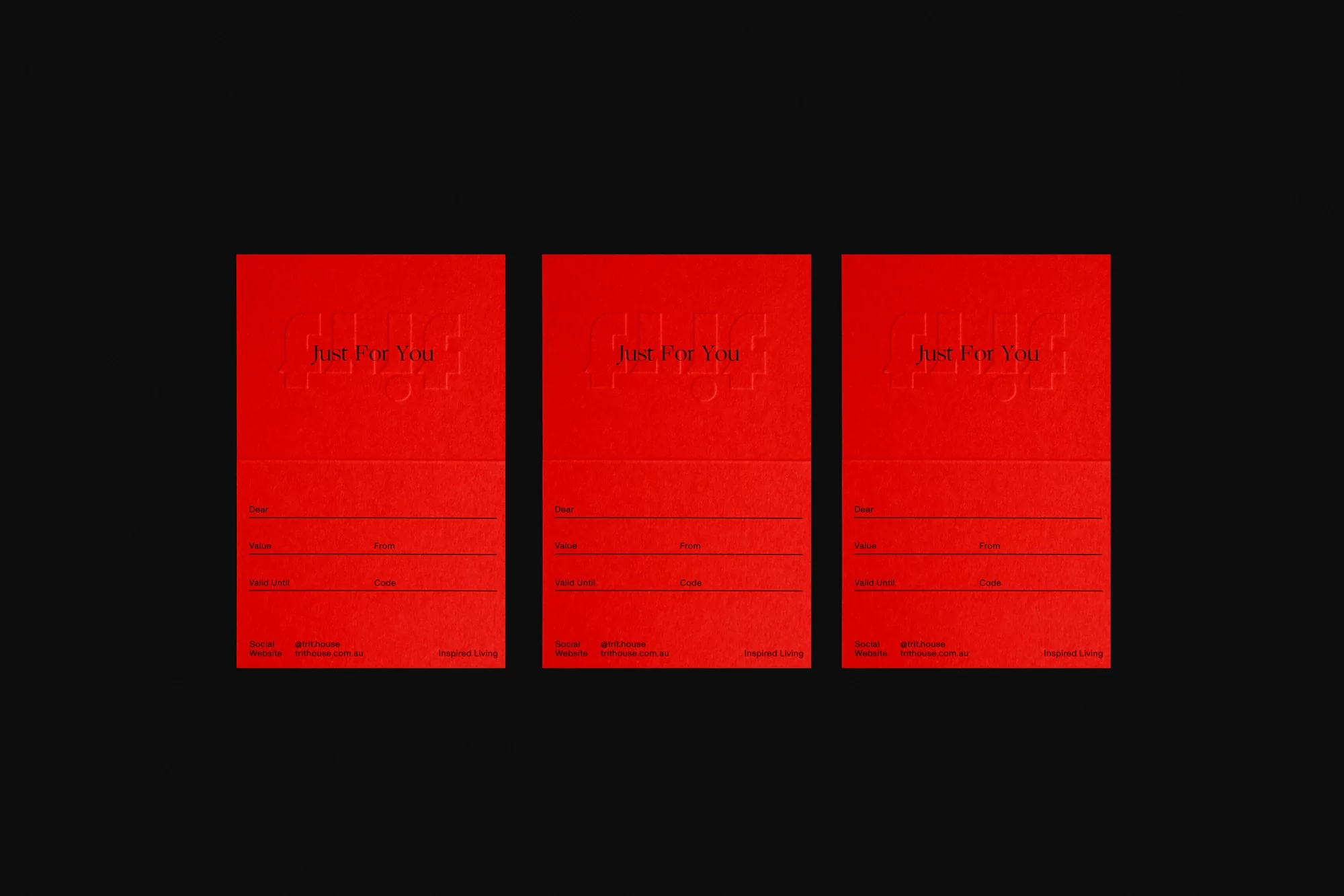 Three identical, bright red gift cards on a black background with the text 'Just For You' embossed on the top portion of each card.