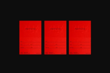 Three identical red paper cards featuring embossed typography and fillable lines on a dark background