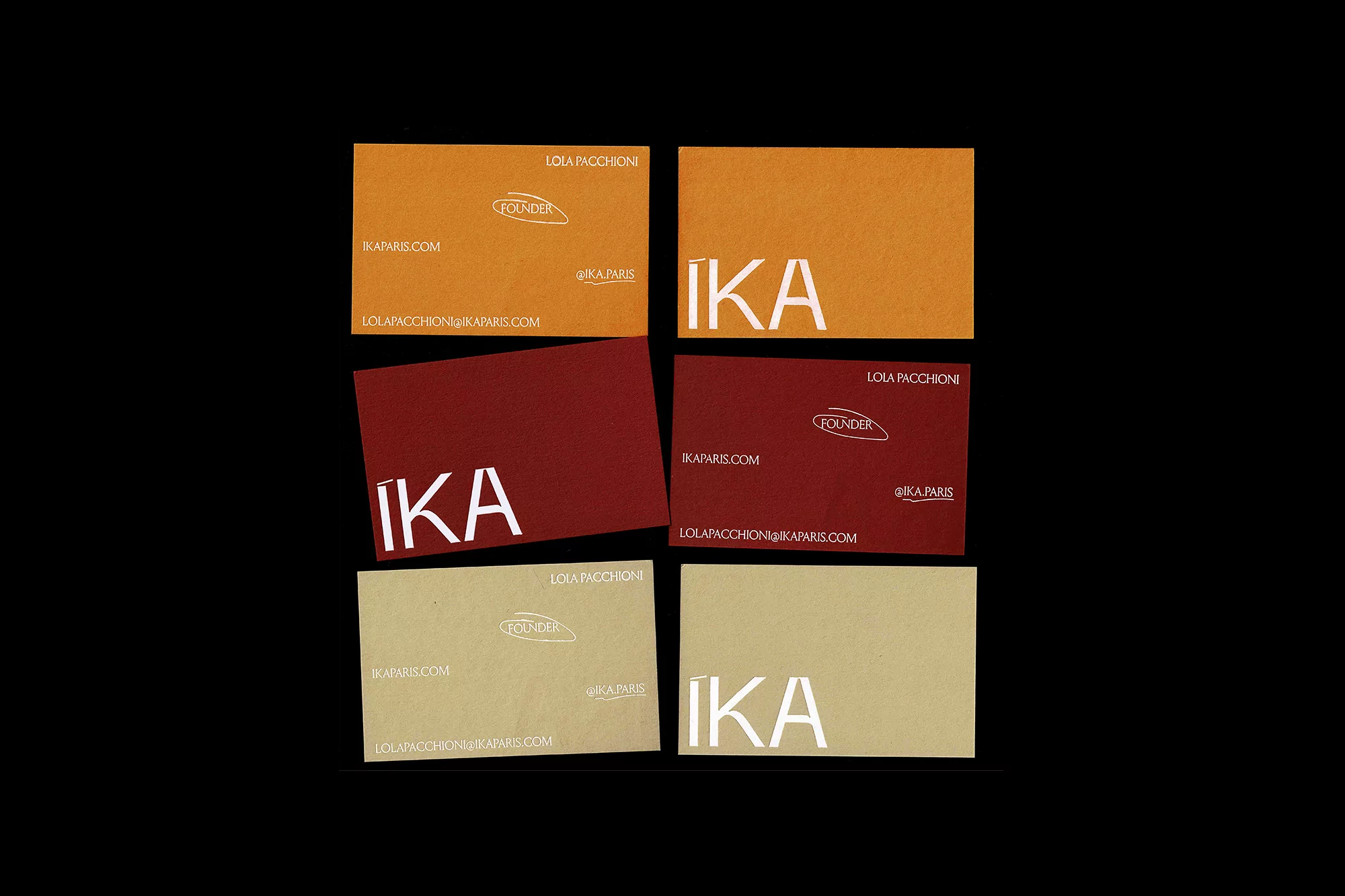 Multiple business cards in shades of brown and red are displayed against a black backdrop, showcasing the brand 'IKA' in bold white lettering.