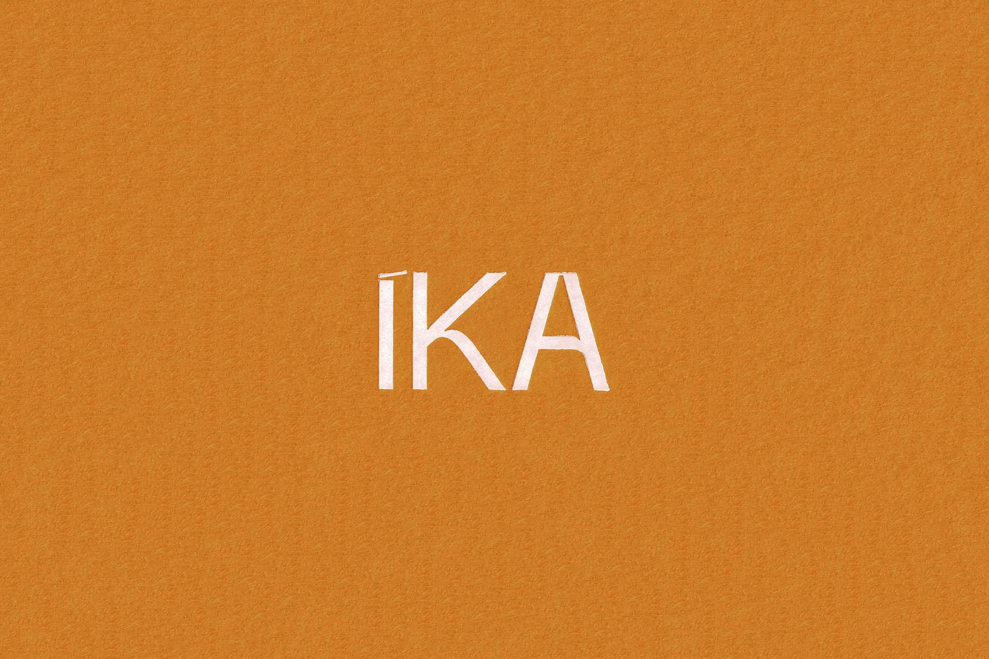 Minimalist background with the word "IKA" in white on orange. Clean, simple design with strong graphic elements and modern aesthetic.