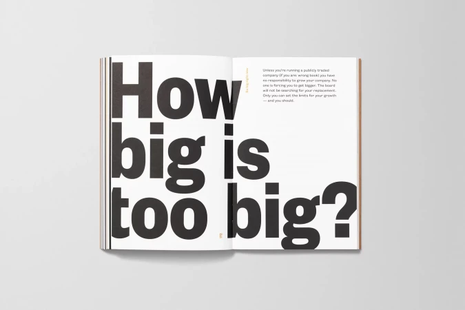 Open book with bold black typography: 'How big is too big?' Text on facing page discusses business growth strategies, white background.
