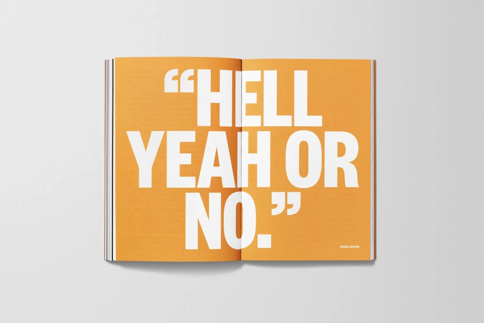 Open book with bold white text 'Hell Yeah or No' on an orange background; minimal design, high contrast, centered composition.