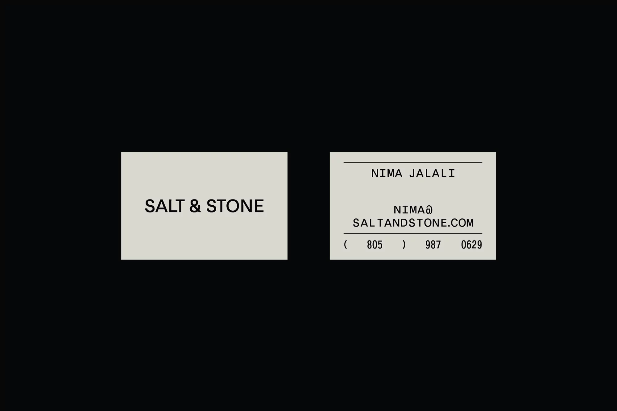 Two business cards with 'Salt & Stone' branding on a dark background, featuring contact details and a clean, minimalist design.