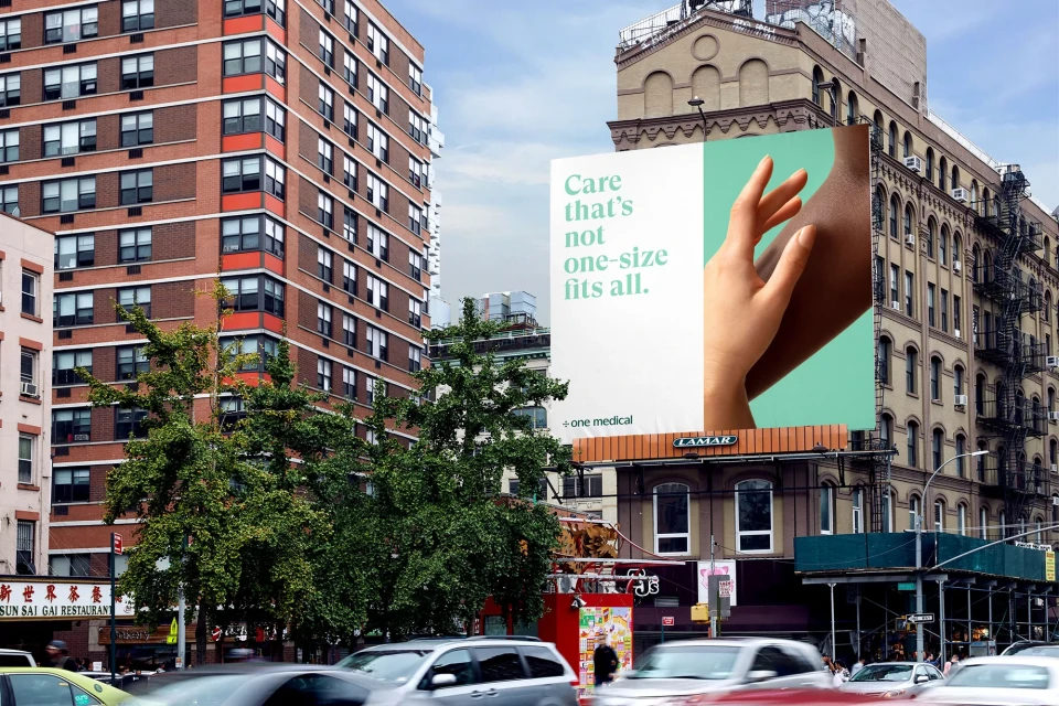 Urban billboard advertises healthcare with a focus on personalized medicine, featuring a diverse hand against a modern city backdrop.