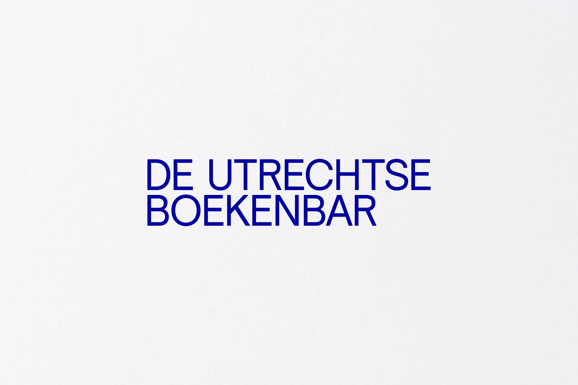 Minimalist image featuring the text 'DE UTRECHTSE BOEKENBAR' in blue against a white background, suitable for a book fair or event.