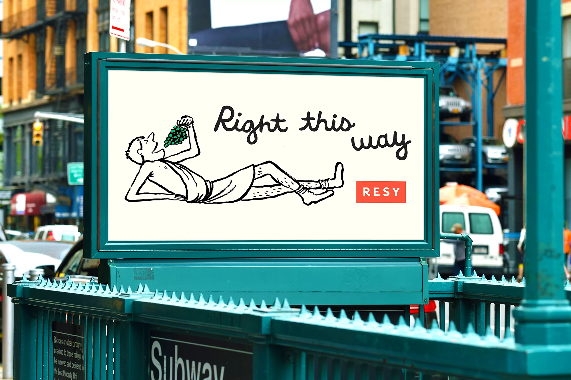 Illustration of a person reclining and eating grapes on a billboard in an urban setting with buildings and a subway entrance.