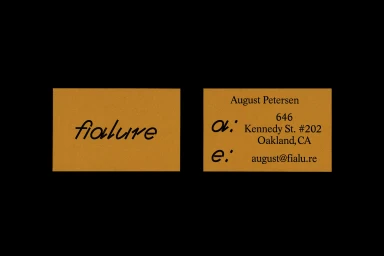 Two amber-toned business cards for Fialure displayed against a black background showing brand typography and contact details.
