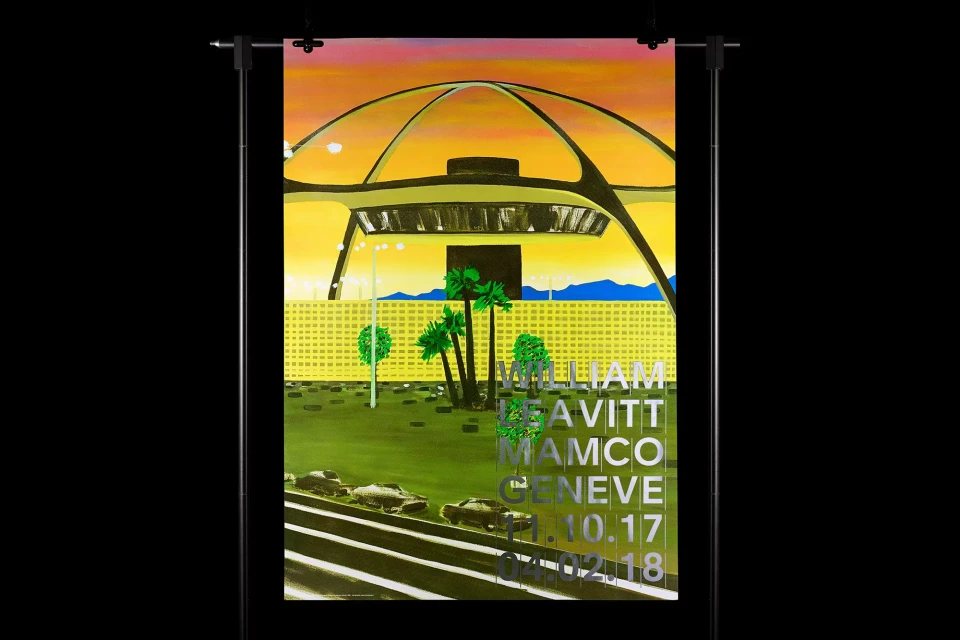 Painted poster artwork on a stand depicting the iconic LAX Theme Building, palm trees, cars, and text against a yellow and orange sky.