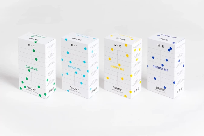 Four white boxes with different colored dot patterns and product names including Calm Me, Mood Me, Happy Me and Energy Me.