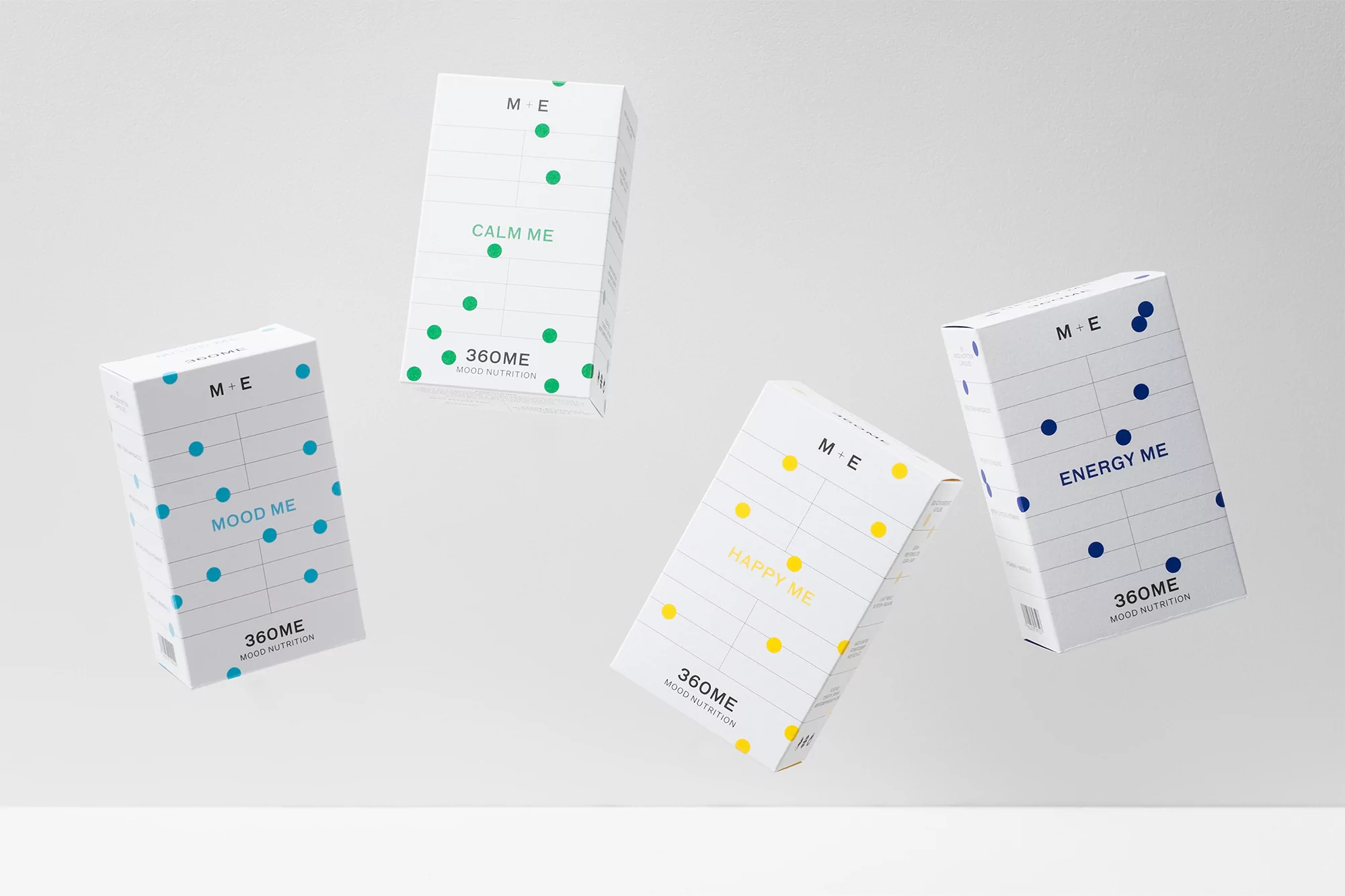 Four boxes of M+E 360ME mood nutrition supplements, each with different colors and labels like 'Calm Me,' 'Mood Me,' 'Happy Me,' and 'Energy Me'.