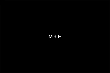 Minimalist black brand identity graphic featuring white letters M and E joined by a plus sign centered on a solid black background.