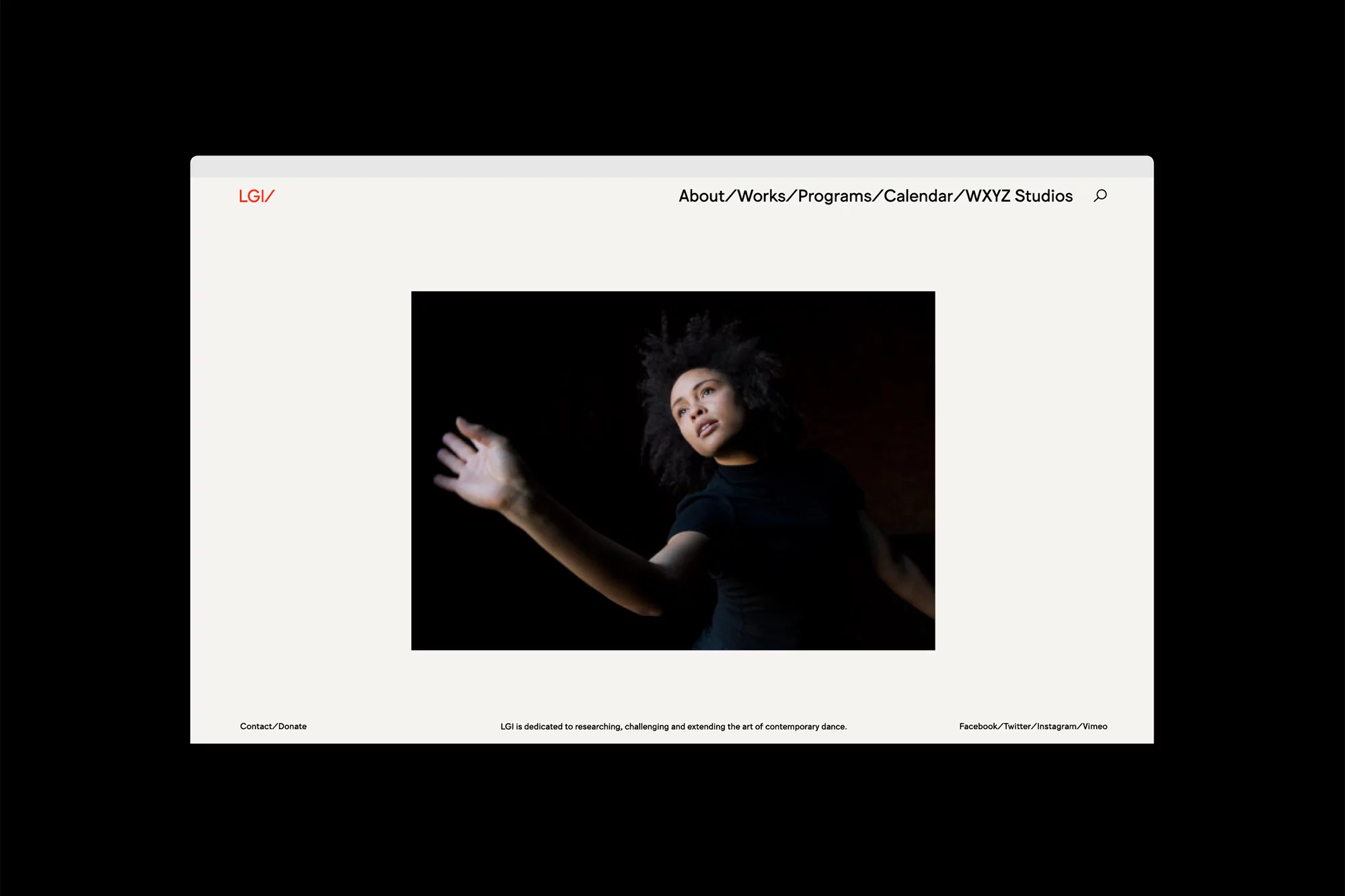 Website display of a woman in a dark top with an outstretched arm, set against a dark background, showcased on a clean, light-themed webpage.