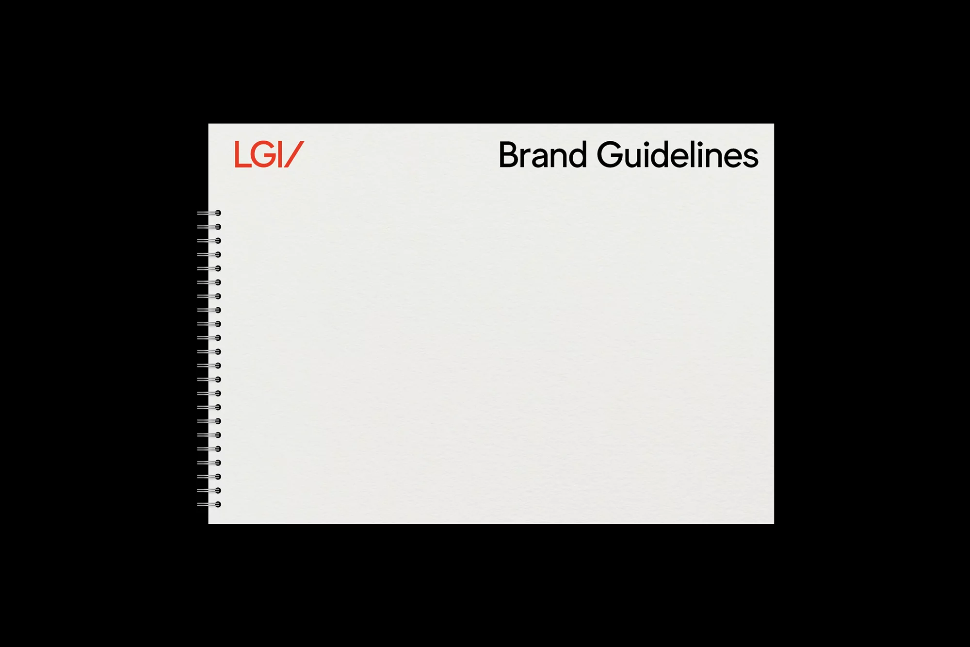 Close-up product shot of a white, wire-bound notebook with red and black text on a black background, displaying brand guidelines.