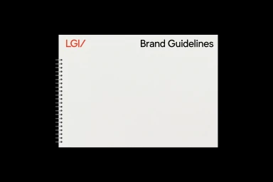 White spiral-bound notebook titled Brand Guidelines with red LGI/ logo set against a black background