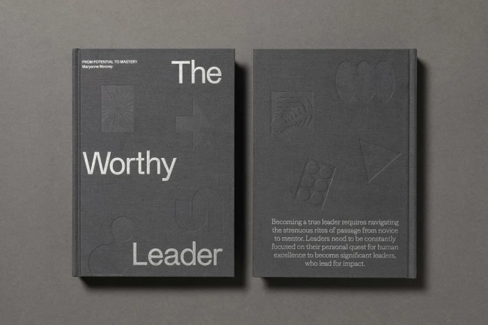 Front and back covers of a grey hardcover book titled The Worthy Leader by Maryanne Mooney displayed on a textured grey background.