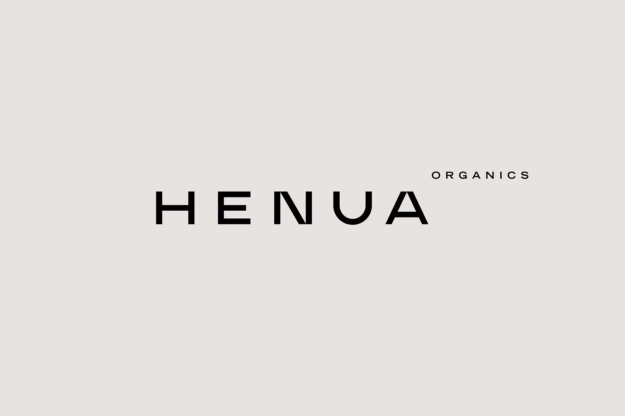 HENUA Organics logo against a light beige background. The text is black, sans-serif typeface. Minimalist aesthetic for branding.
