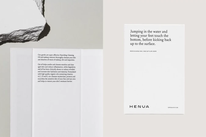 Promotional still life featuring Henua Organics skincare product packaging, displaying informational text and brand logo with a neutral background.