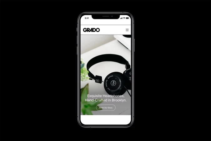 Grado headphones website displayed on a smartphone screen, showcasing the brand's aesthetic and product line against a black background.