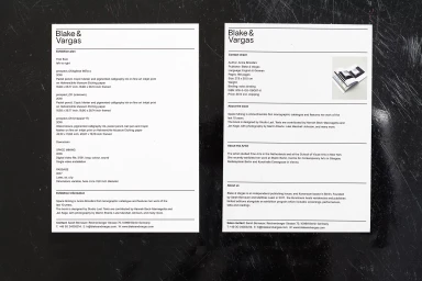 Two printed information sheets for Blake & Vargas featuring exhibition plan and contact details against a dark textured surface