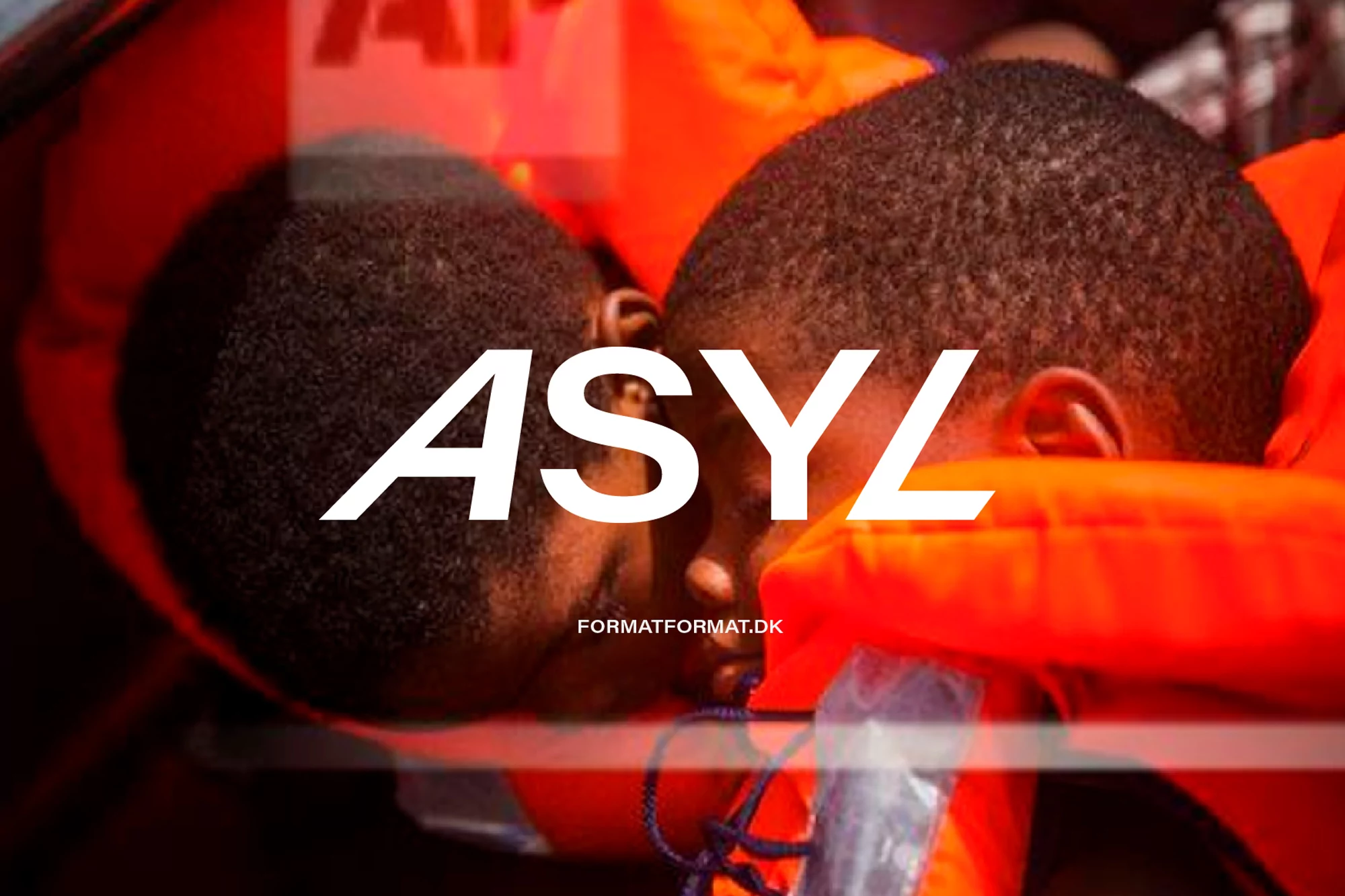 Close-up of two adult males wearing orange life vests, with white text overlay, shot in a shallow depth of field.