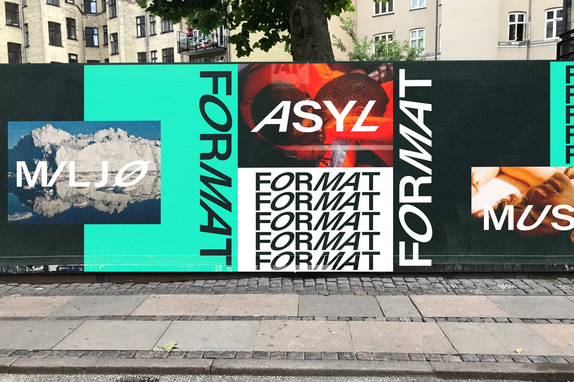 Format brand identity poster installation featuring typography, graphic panels, and imagery displayed on an urban street.