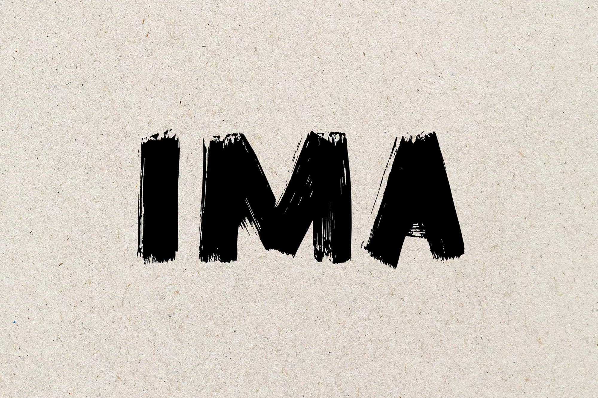 Brushstroke style black text 'IMA' on a textured beige background, creating a bold and artistic graphic element with a handmade feel.