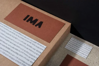 Studio Ima brand identity collateral featuring brown paper packaging, patterned cards, and bold typography.