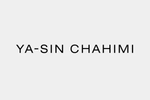 Black minimalist typography reading Ya-Sin Chahimi centered against a plain light grey background