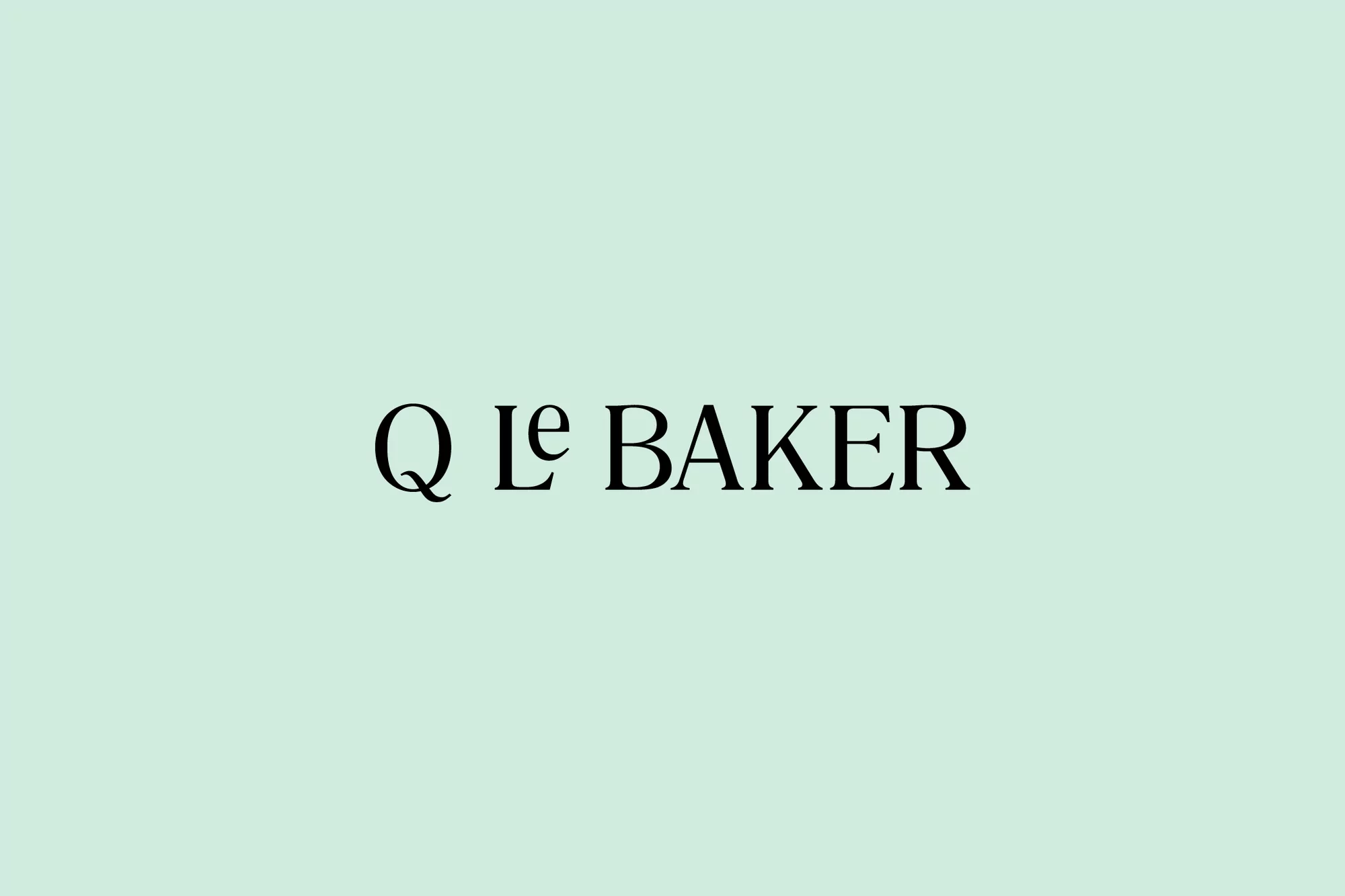 Simple design showcasing the 'Q le Baker' logo in black, set against a light green background, creating a clean and minimalist aesthetic.