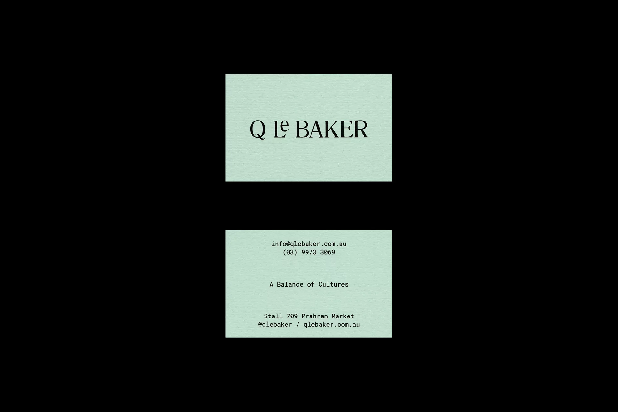 Promotional image showcasing two light-green business cards with black text against a black background, featuring the company name Q Le Baker.