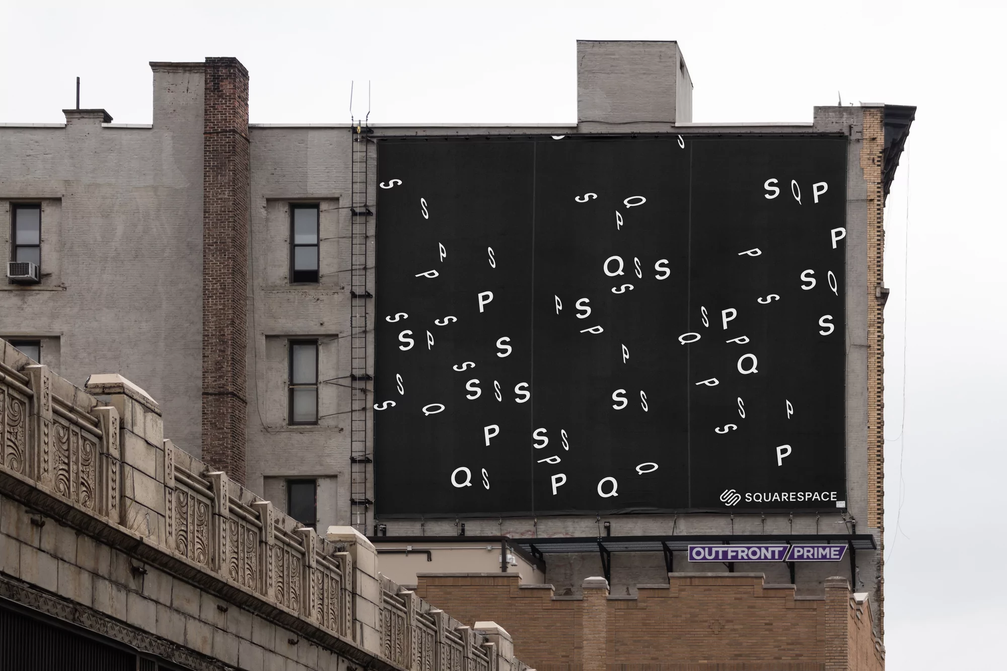 Billboard on the side of a building features white, stylized letters (S, P, Q) against a black background, with the Squarespace logo.