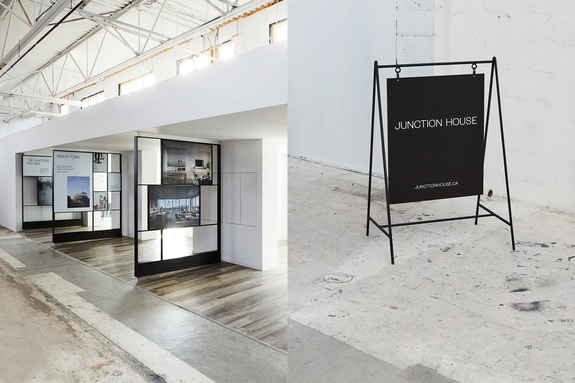 Real estate advertising display inside of an industrial building. Includes a black sandwich board sign and architectural renderings.