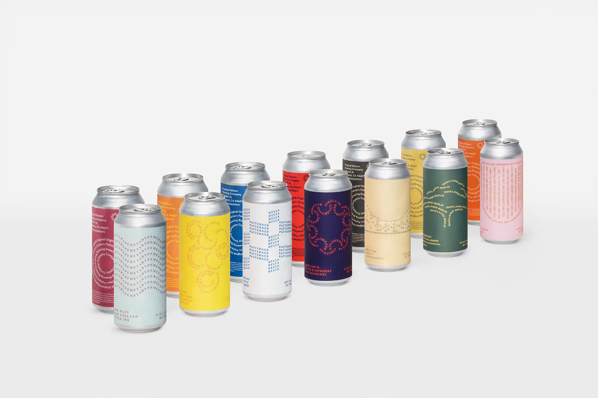 Various colorful cans are arranged in a group, each with its own unique design and color, set against a bright white background.