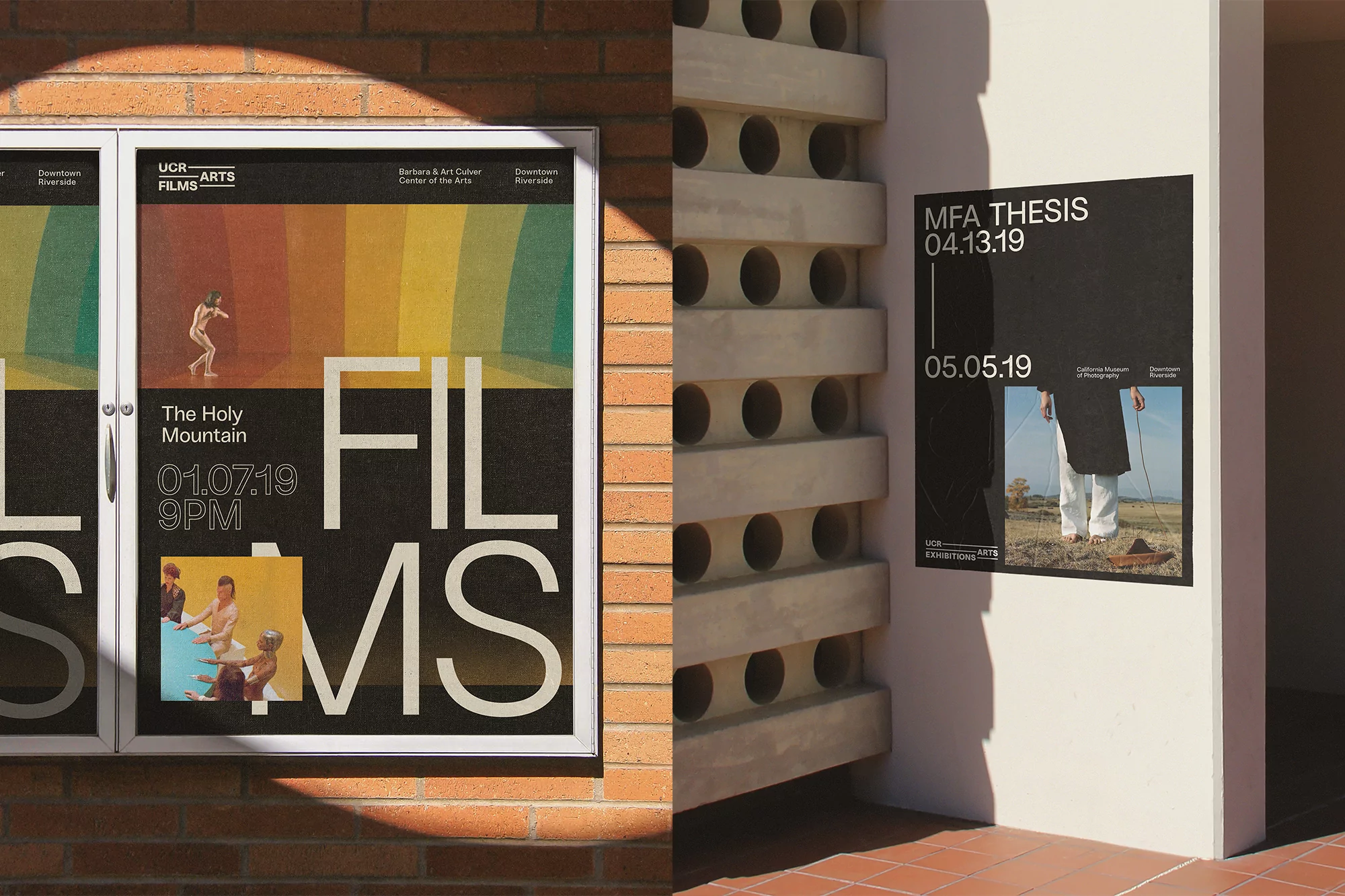 Two film posters for UCR Arts, one featuring 'The Holy Mountain', are mounted on a brick wall and the side of a building.