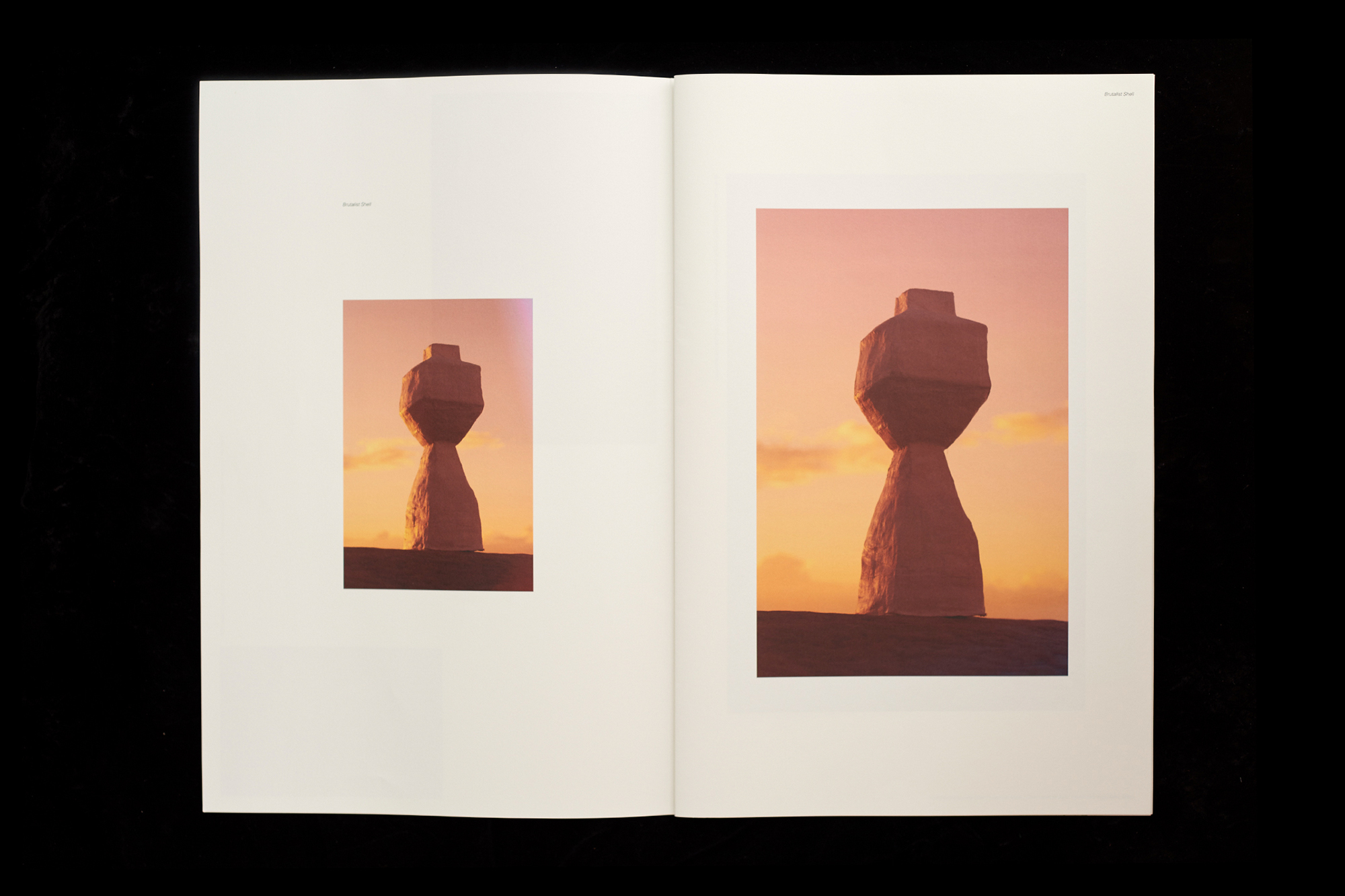 Tomb-like sculpture on a book spread is bathed in a warm, sunset-like glow, casting soft shadows, and evokes a sense of stillness.