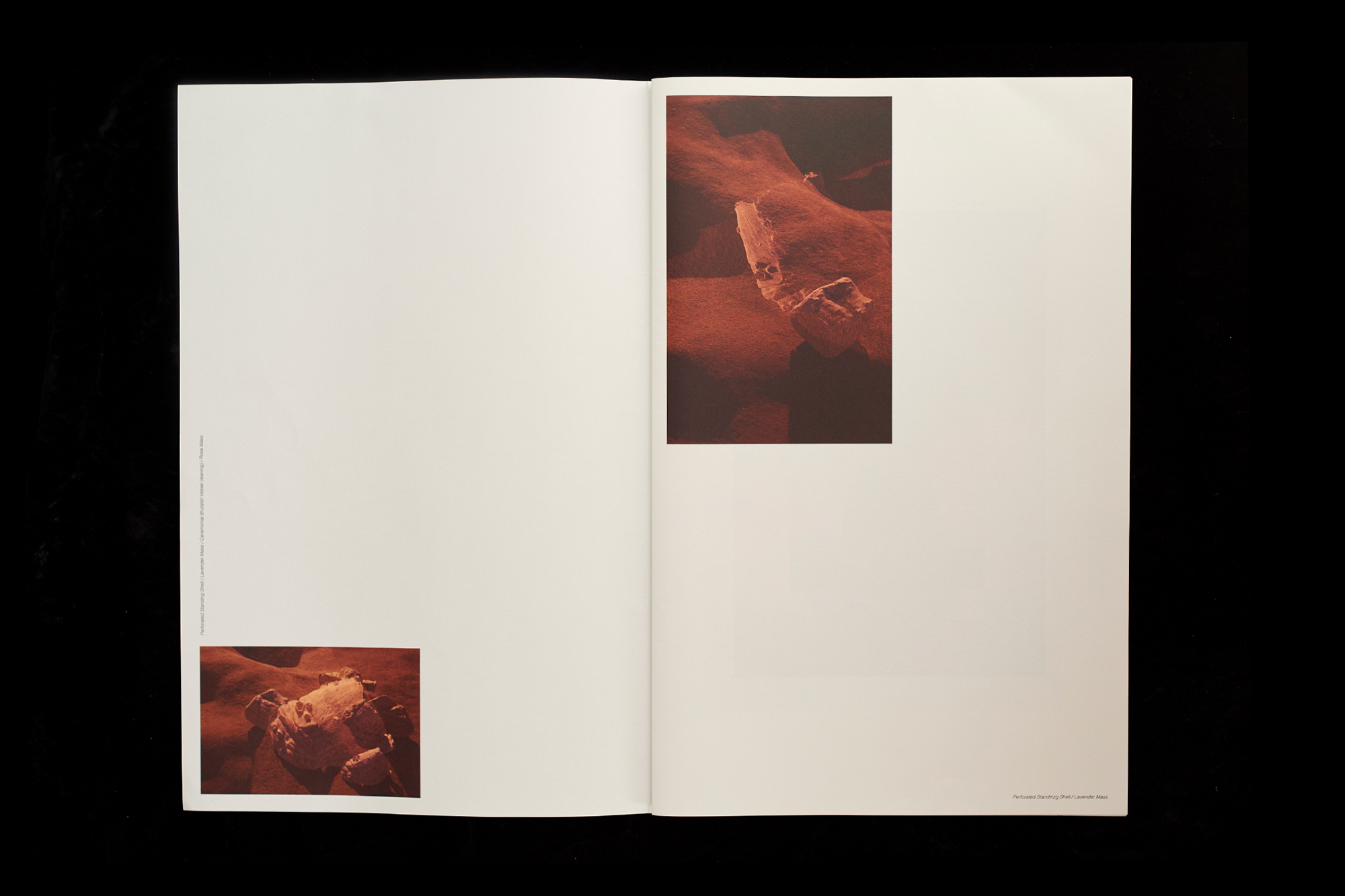 Open book spread featuring images of textured, reddish-brown rocks and sand, creating an artistic and visually compelling composition.