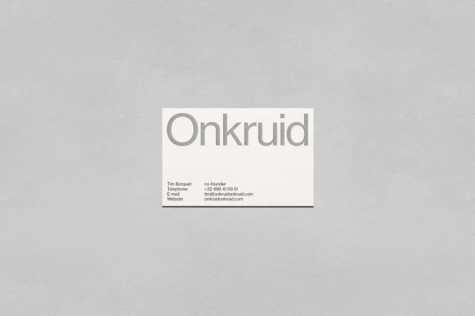 Minimalist business card featuring the company name 'Onkruid' and contact details for Tim Borguet against a grey background.