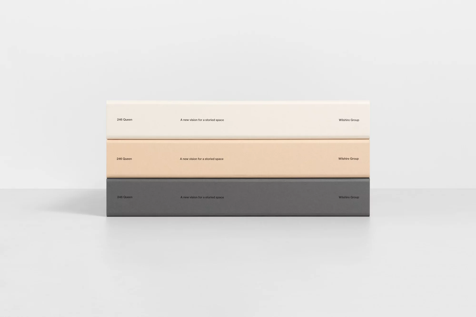Three stacked presentation blocks in neutral hues (cream, tan, grey) feature text snippets, set against a pristine white background.