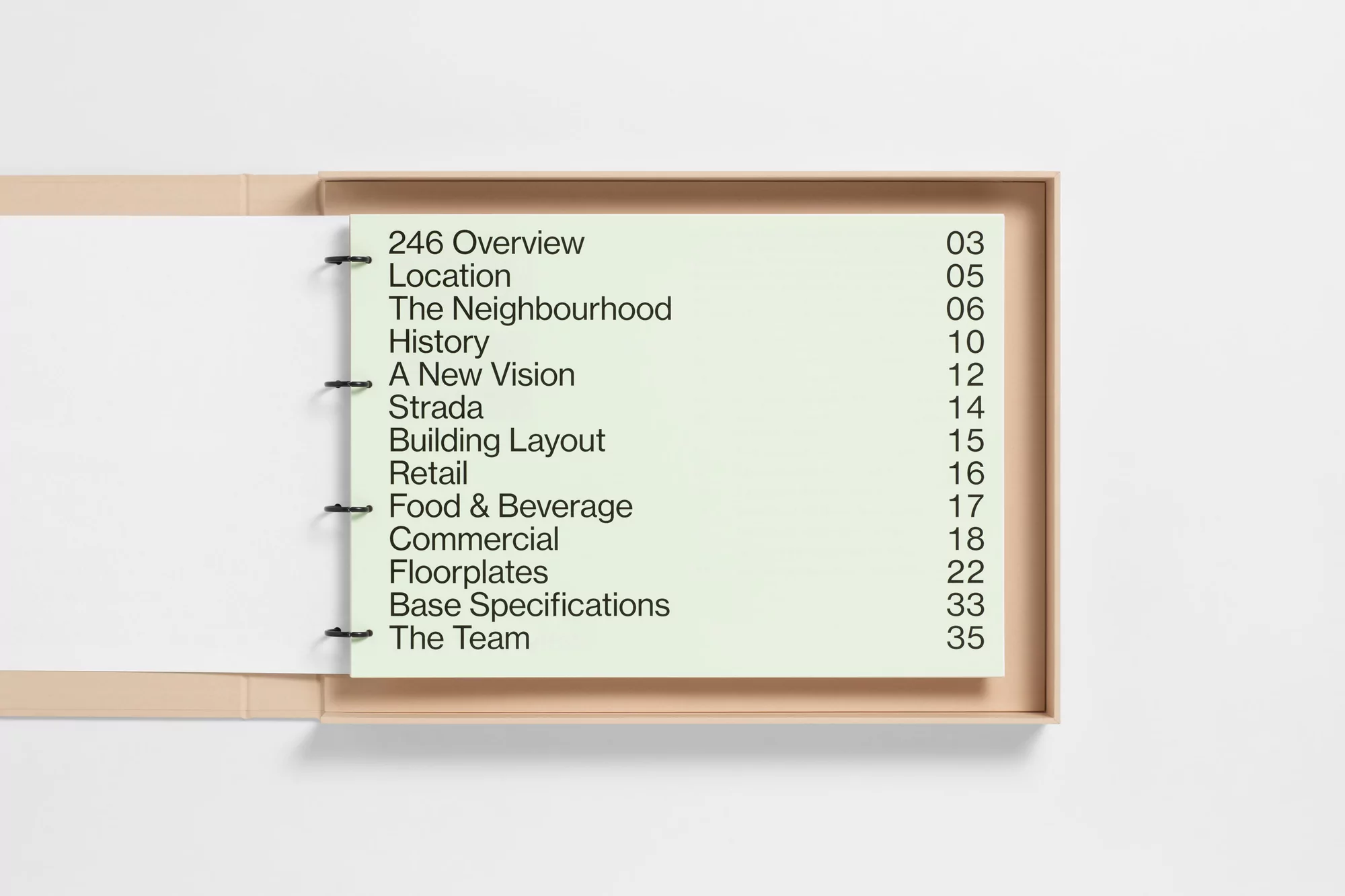 Open binder with title page featuring a contents page for a building project, with headings such as 'Location' and 'Food & Beverage'.
