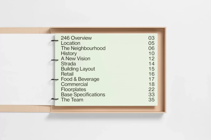 Open binder with title page featuring a contents page for a building project, with headings such as 'Location' and 'Food & Beverage'.