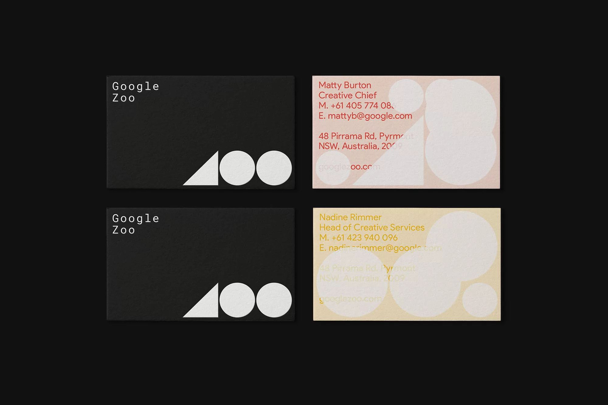 Two black and two tan Google Zoo business cards with contact information and geometric designs; professional stationery for business networking.