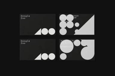 Four black business cards featuring minimalist white geometric typography and abstract shapes for Google Zoo brand identity