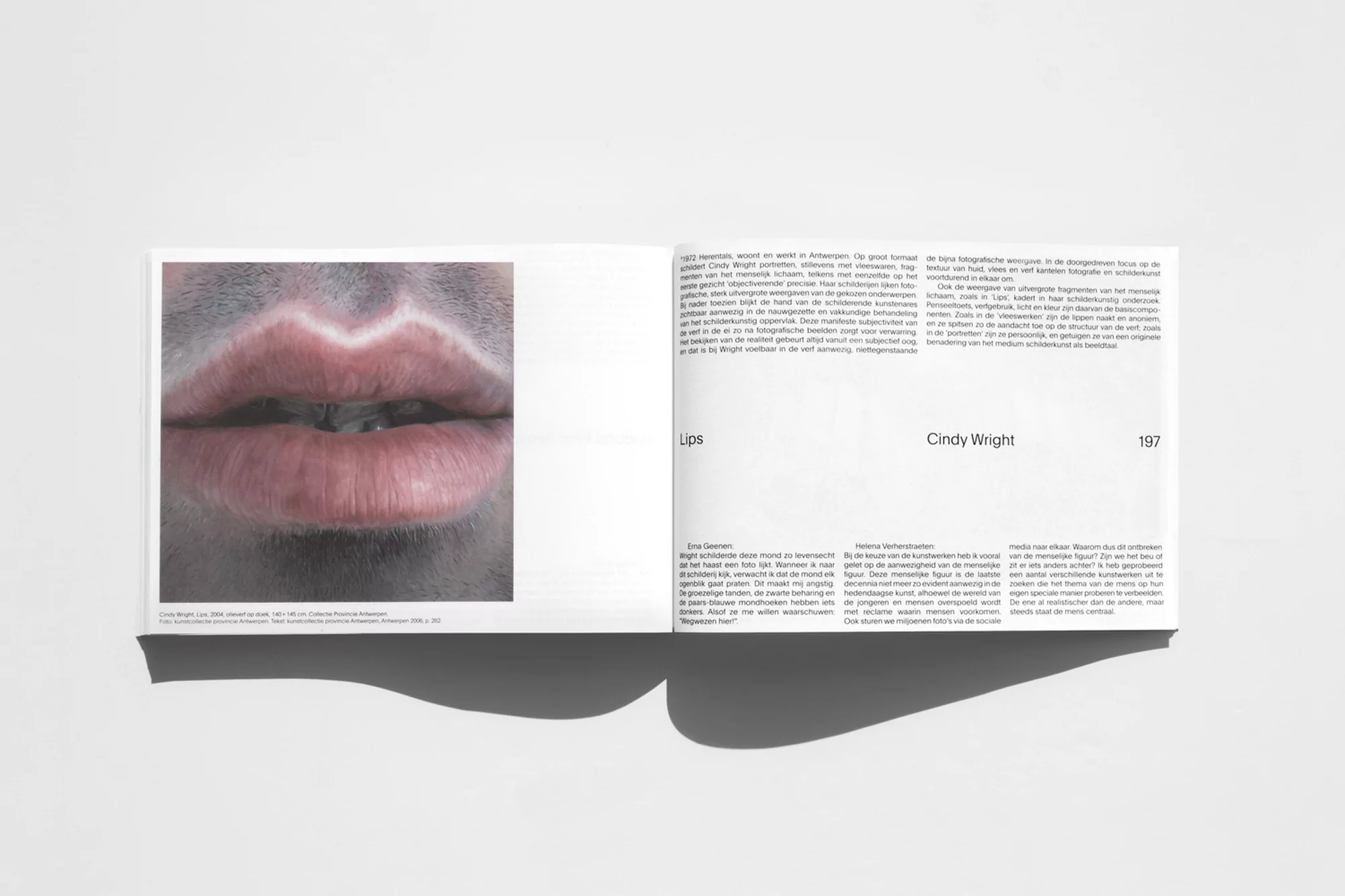 Open book spread featuring a close-up photograph of lips with white paint along the edge, accompanied by text on the opposite page.