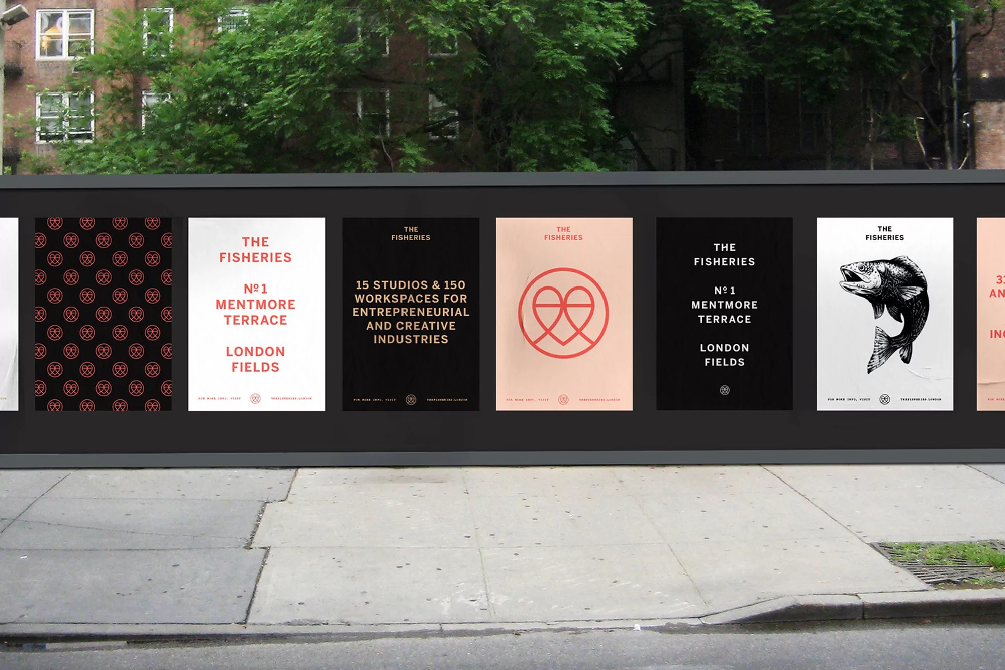 Outdoor billboard featuring posters for The Fisheries, showcasing typography and minimalist design elements in an urban setting.