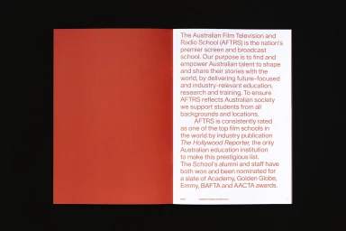 Open book spread showing a solid red left page and descriptive typography on the right page against a black background.