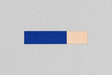 FranklinTill brand identity graphic design featuring embossed typography on blue and peach paper swatches against textured grey