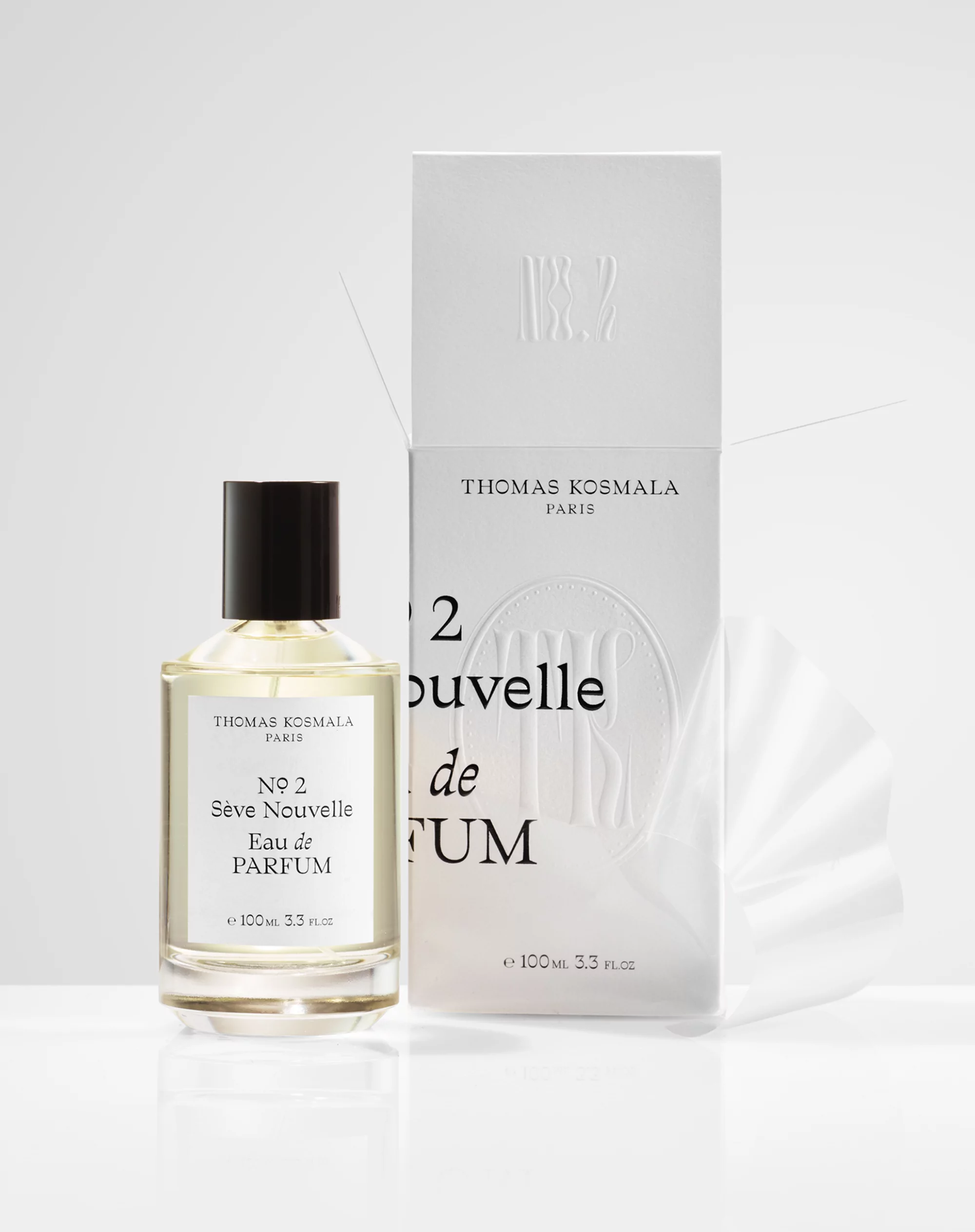 Thomas Kosmala No 2 Sève Nouvelle Eau de Parfum: a sleek bottle and box against a clean white backdrop in a studio setting.