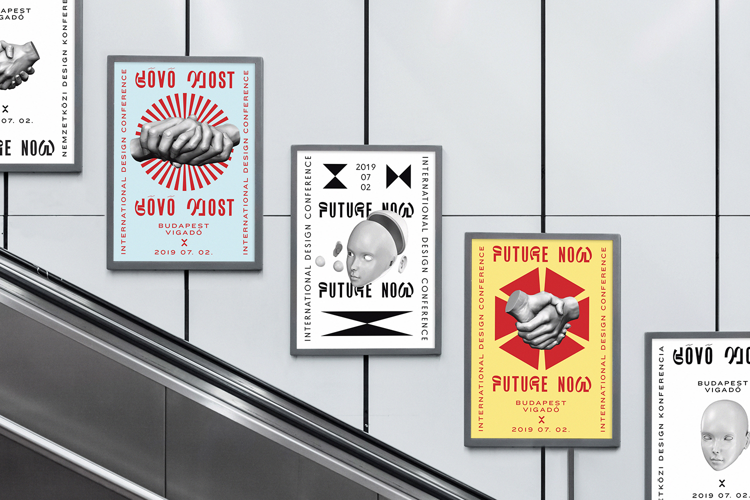 Posters for the 'Future Now' international design conference are mounted on a tiled wall next to a modern gray escalator in an indoor setting.